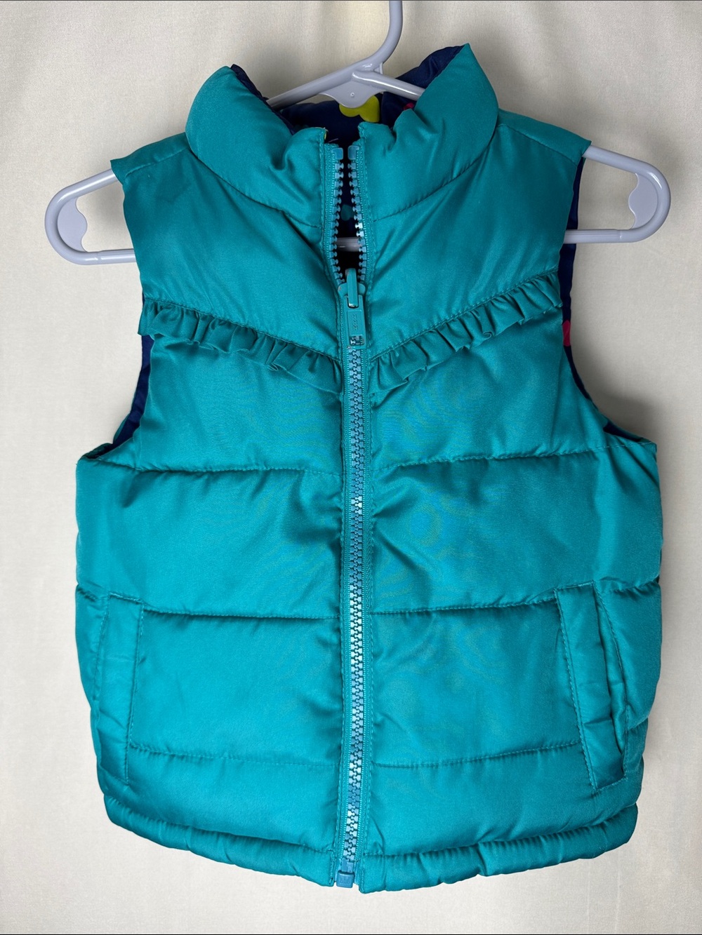 Girls Reversible Teal, Navy & Hearts Puffer Vest with Ruffle Detail